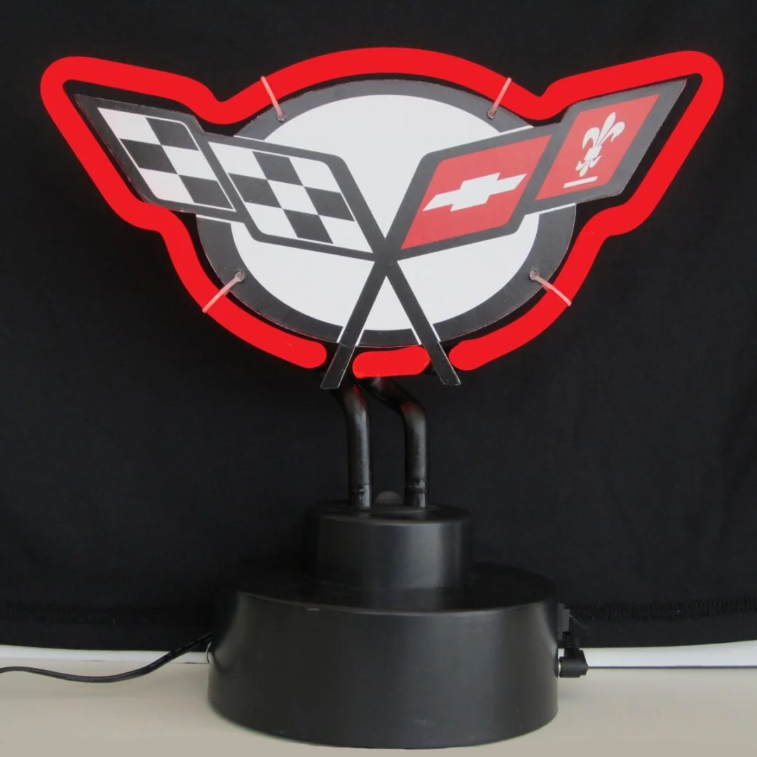 Corvette C5 Neon Sculpture with hand-blown neon tubing on a black display base