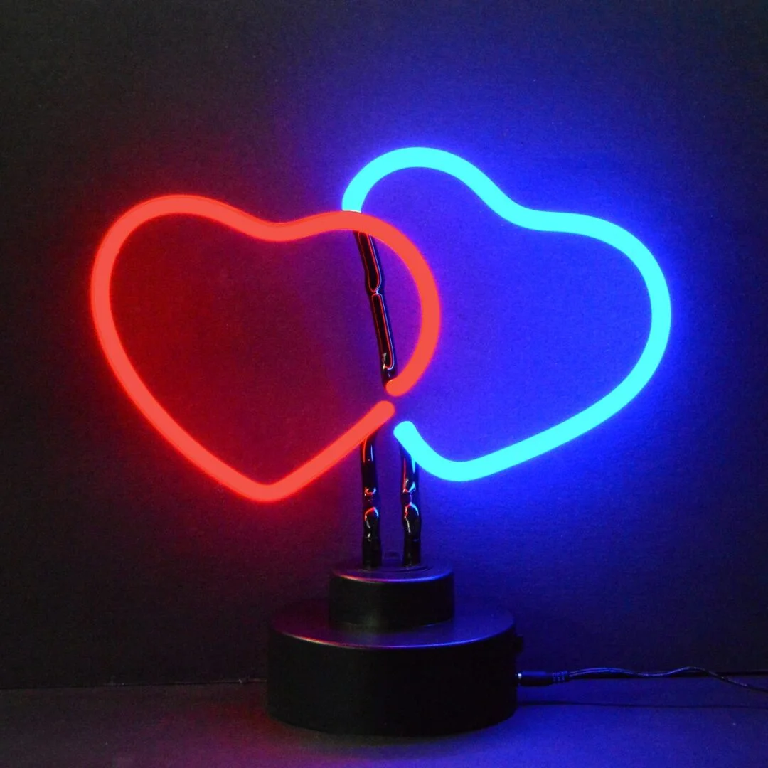 Double Hearts Neon Sculpture with hand-blown neon tubing on a black display base