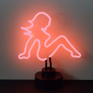 Pink Mud Flap Girl neon sculpture on a black display base