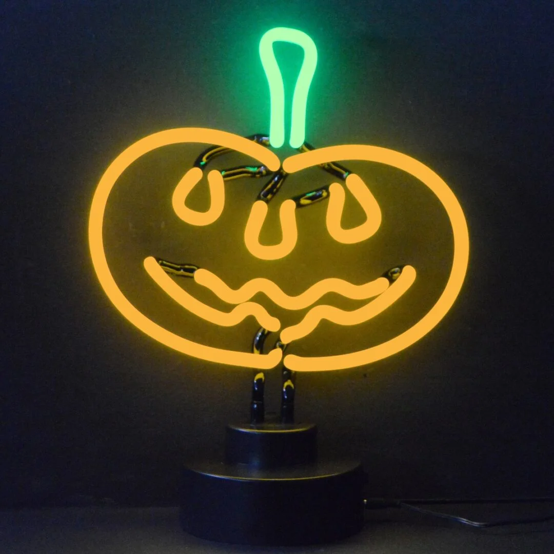 Pumpkin neon sculpture glowing orange and green