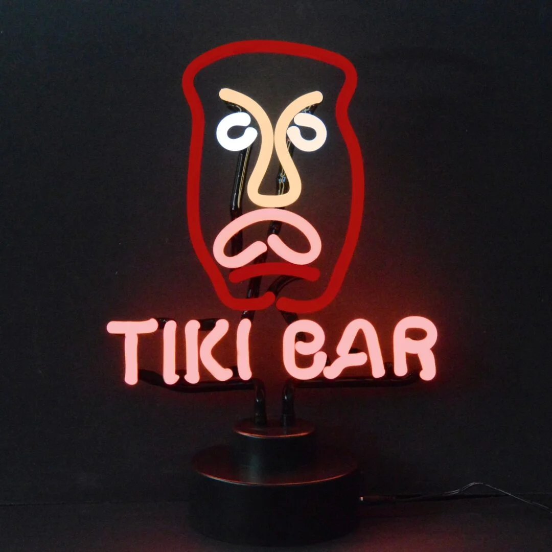 Tiki face neon sculpture with red TIKI BAR lettering